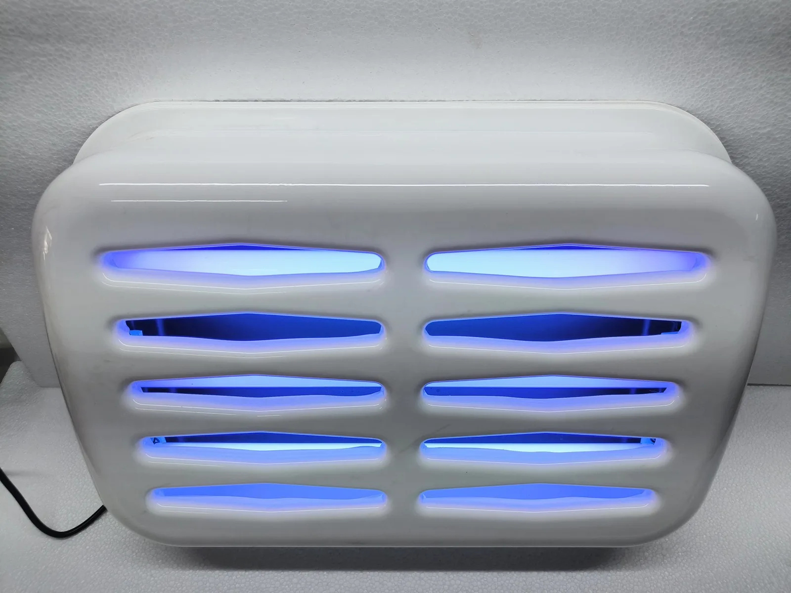 Triple tube glue pad fly catcher, wall mounted with UV tubes lit